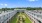 beautiful aerial of central courtyard with walkways and trees, surrounded by two levels of apartments