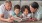 kids sitting on the floor reading a book